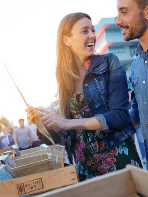 Couple,Walking,By,Flea,Market,In,Late,Afternoon
