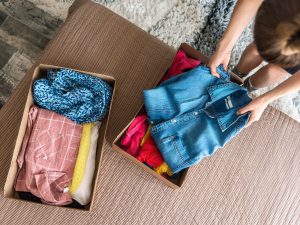 Woman,Preparing,Used,Clothes,For,Clothing,Swap.,Concept,Of,Waste